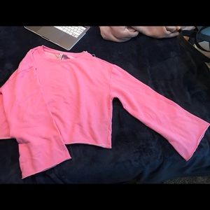 pink sweatshirt with fan sleeves